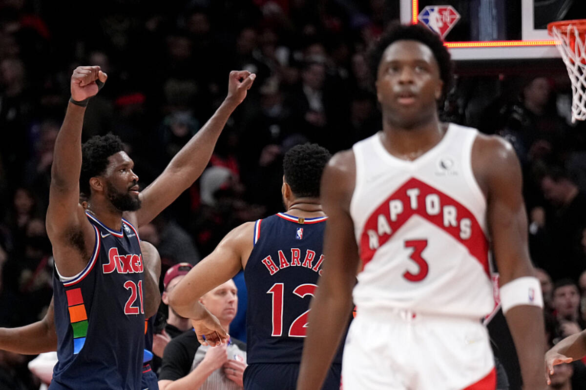 Toronto Raptors forward OG Anunoby (3) reacts as Philadelphia 76ers centre Joel Embiid (21) celebrates the 76ers win with forward Tobias Harris (12) in overtime NBA first round playoff action in Toronto on Wednesday April 20, 2022. THE CANADIAN PRESS/Nathan Denette