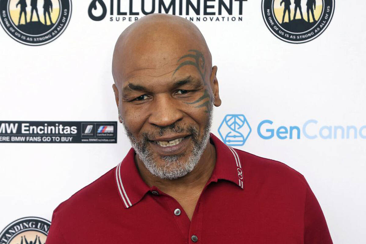 In this Aug. 2, 2019 photo, Mike Tyson attends a celebrity golf tournament in Dana Point, Calif. Authorities are investigating after cellphone video appears to show Mike Tyson hitting another passenger on a plane at San Francisco International Airport. (Photo by Willy Sanjuan/Invision/AP, File)