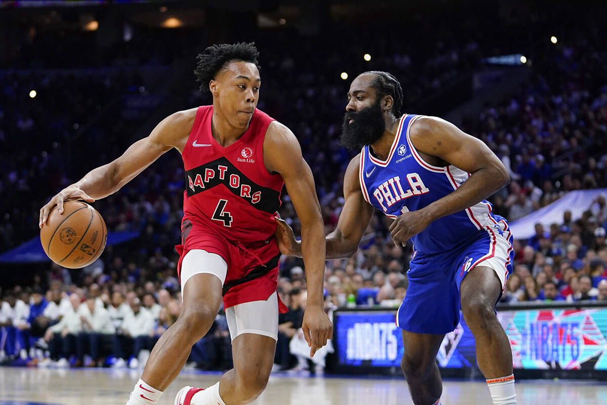 Toronto Raptors’ Scottie Barnes, left, tries to get past Philadelphia 76ers’ James Harden during the first half of Game 5 in an NBA basketball first-round playoff series, Monday, April 25, 2022, in Philadelphia. (AP Photo/Matt Slocum)