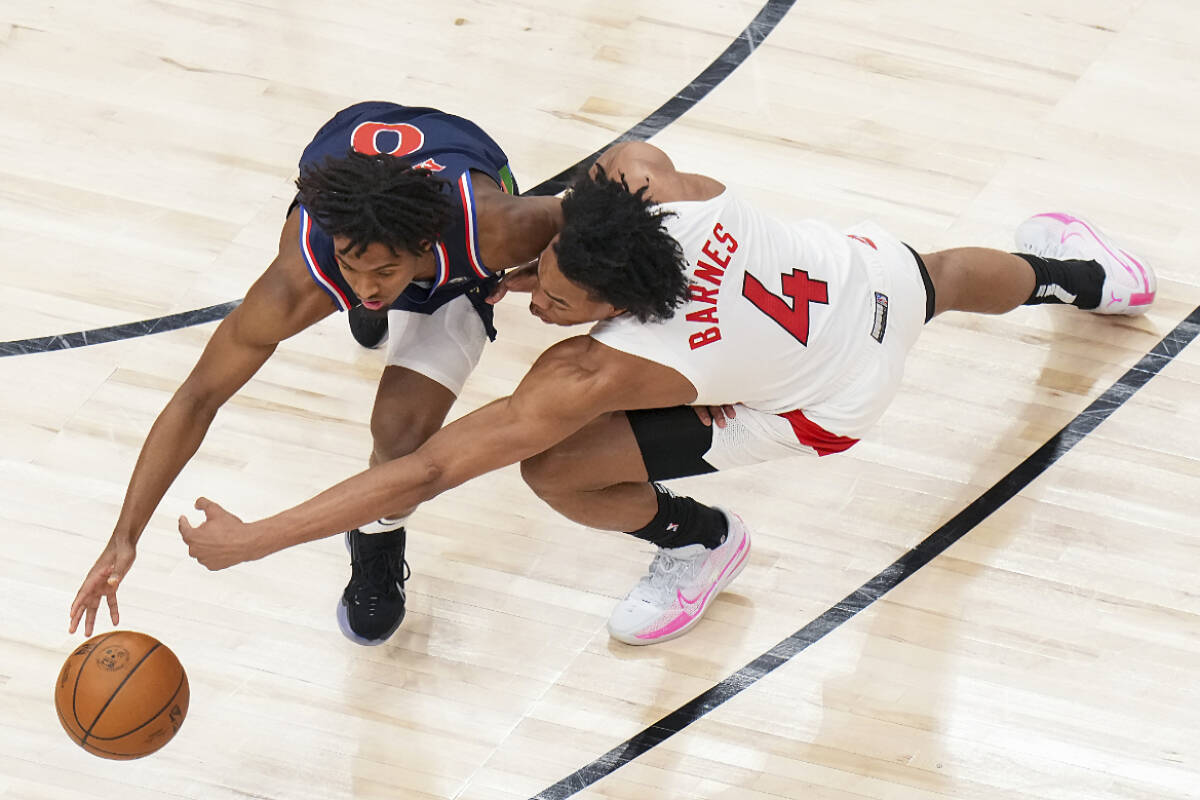 Toronto Raptors forward Scottie Barnes (4) battles for ball against Philadelphia 76ers guard Tyrese Maxey (0) during second half NBA round one playoff basketball action in Toronto on Thursday, April 28, 2022. THE CANADIAN PRESS/Nathan Denette