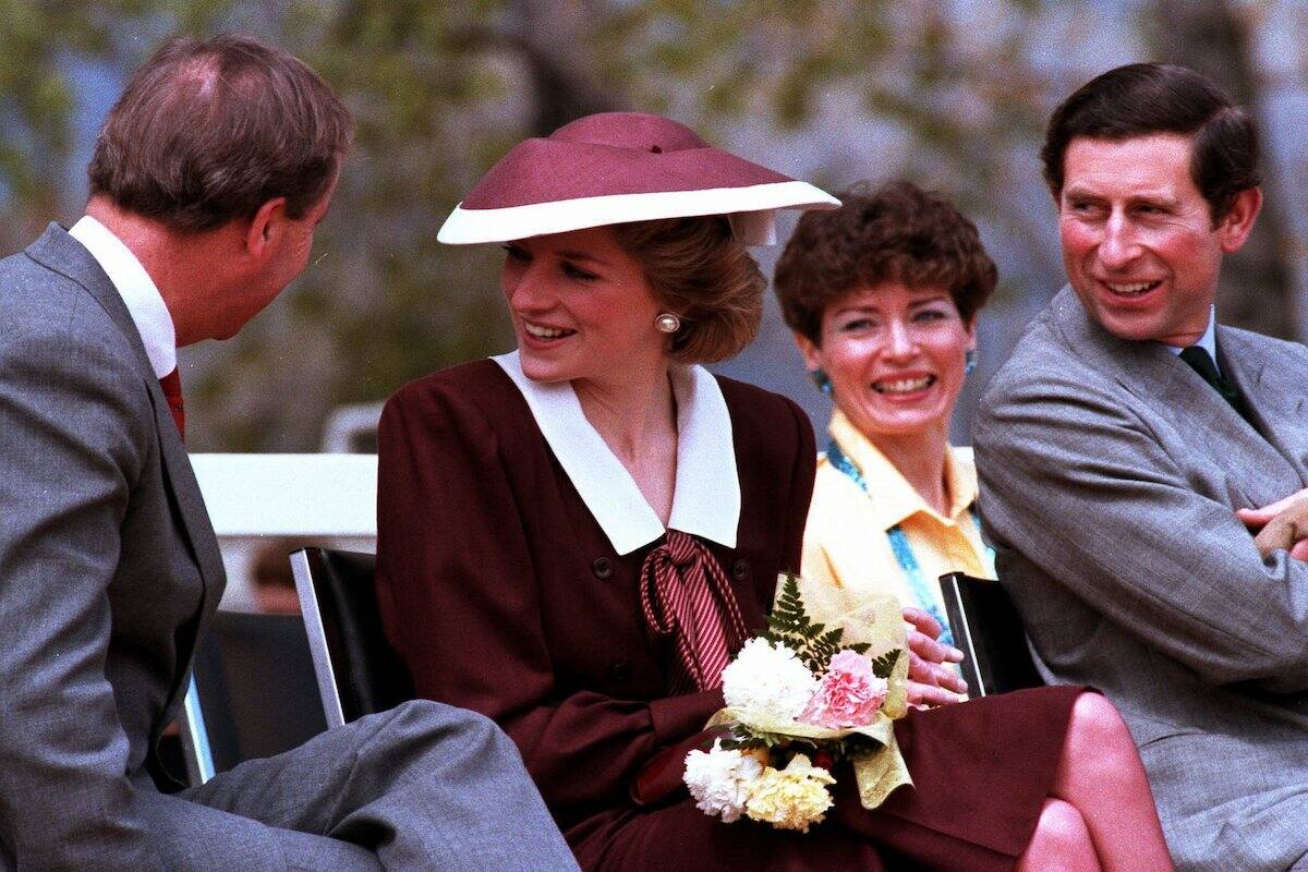 Diana, Princess of Wales bends laughs at something over the shoulder of British Columbia Premier Bill Bennett while Prince Charles looks on. Prince Charles and Diana, Princess of Wales, were in Kelowna, B.C., May 3, 1986 for a brief visit as part of their eight day stay in Canada. (CP PHOTO/Ron Poling)