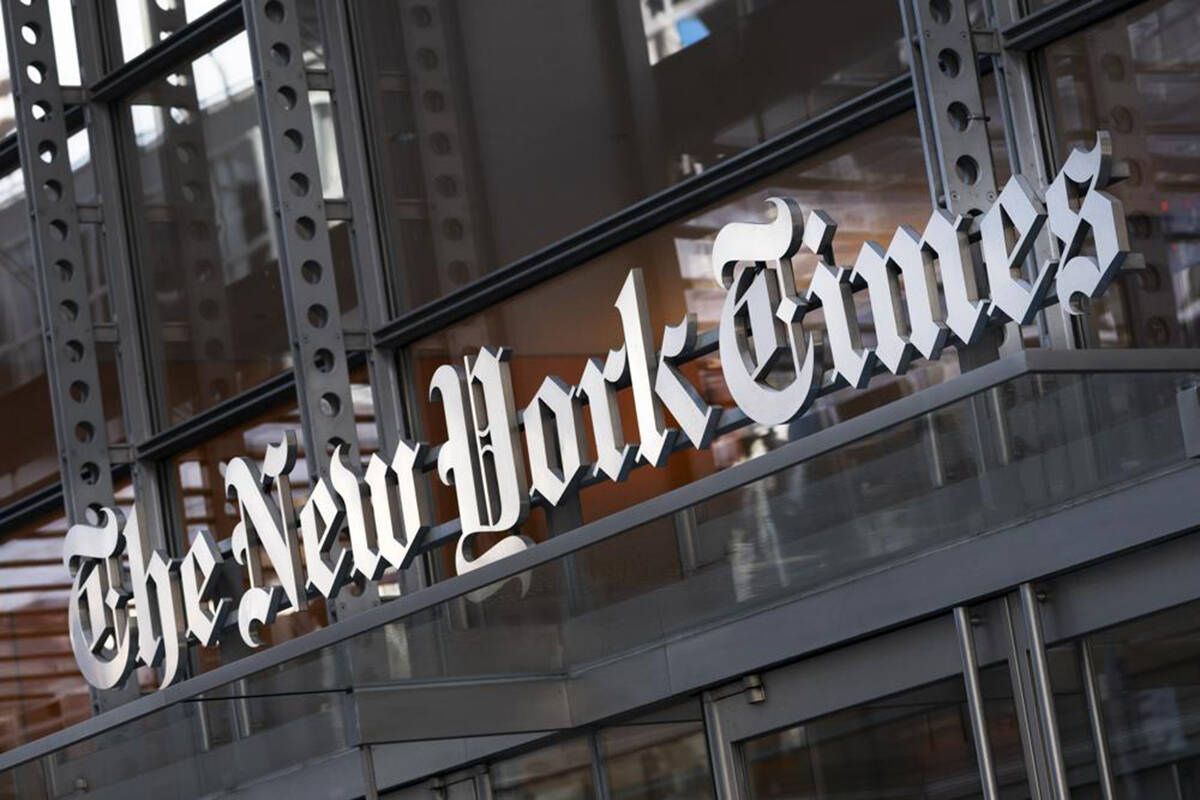 A sign for The New York Times hangs above the entrance to its building, Thursday, May 6, 2021 in New York. The New York Times moved swiftly to change the word fetus, Monday’s answer to its daily Wordle puzzle, out of fear that it would be seen as some sort of commentary on the debate over abortion rights. The game, which became a sensation late last year and was bought by The Times in January, gives users six tries to guess a different five-letter word each day. (AP Photo/Mark Lennihan, File)