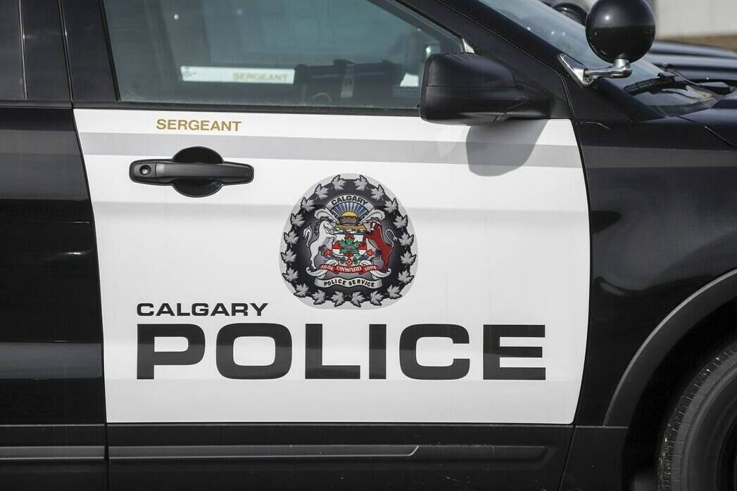 Police vehicles at Calgary Police Service headquarters in Calgary on April 9, 2020. THE CANADIAN PRESS/Jeff McIntosh