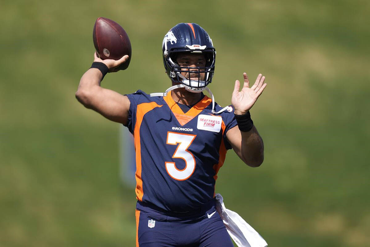 Denver Broncos quarterback Russell Wilson takes part in drills at the NFL football team’s voluntary veteran minicamp Wednesday, April 27, 2022, at the team’s headquarters in Englewood, Colo. (AP Photo/David Zalubowski)