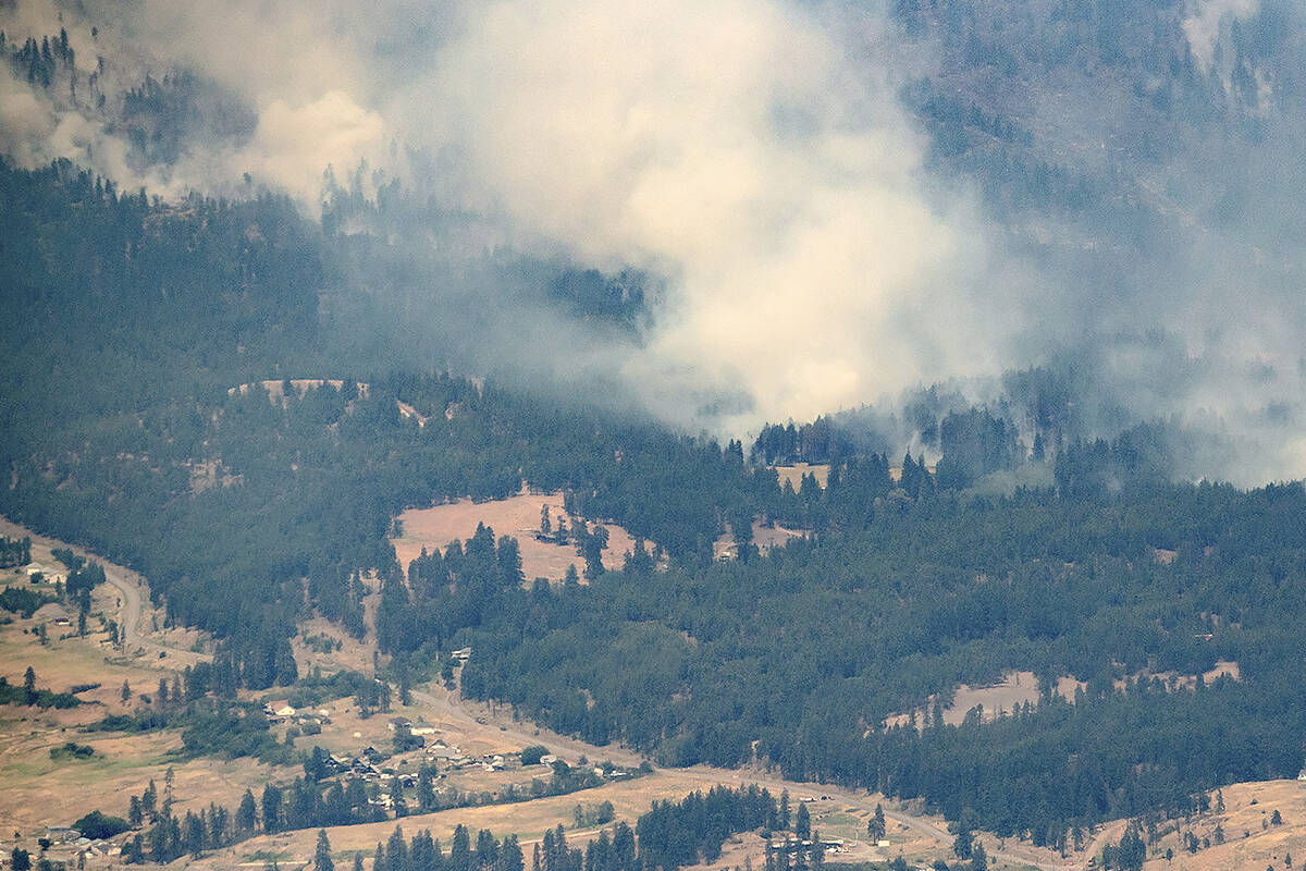 A wildfire burns in the mountains north of Lytton on July 1, 2021. According to a survey 2022 survey by BCAA, most British Columbians fear more extreme weather events. (Darryl Dyck/The Canadian Press via AP, File)