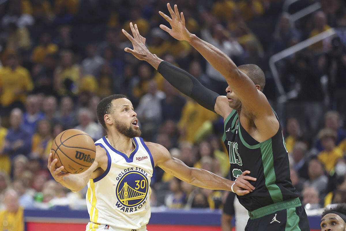 Golden State Warriors guard Stephen Curry (30) shoots against Boston Celtics centre Al Horford during the first half of Game 5 of basketball’s NBA Finals in San Francisco, Monday, June 13, 2022. (AP Photo/Jed Jacobsohn)