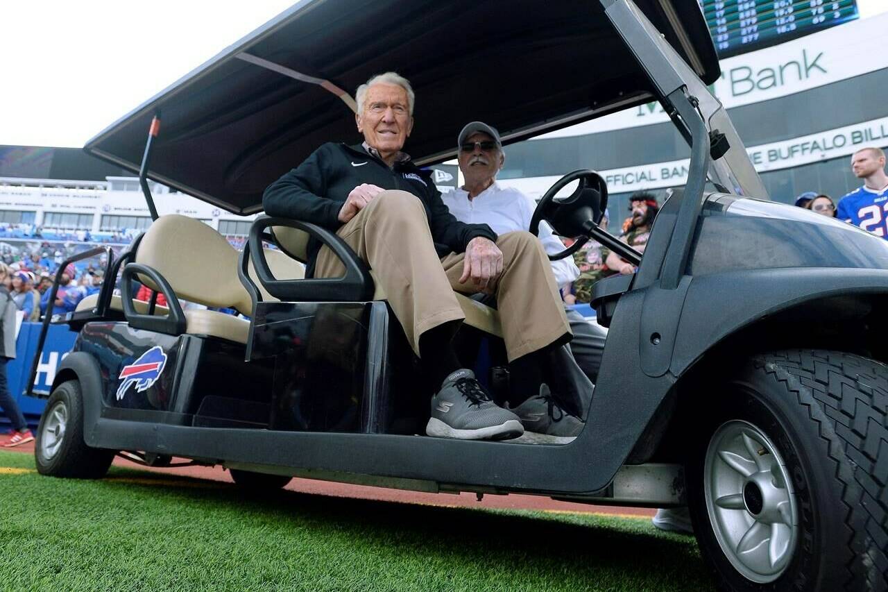 Former Buffalo Bills head coach Marv Levy watches the team warm up before an NFL football game between the Bills and the New England Patriots, Sunday, Sept. 29, 2019, in Orchard Park, N.Y. On Friday night, the former Montreal Alouettes head coach will be inducted into the Canadian Football Hall of Fame. THE CANADIAN PRESS/AP Photo/Adrian Kraus