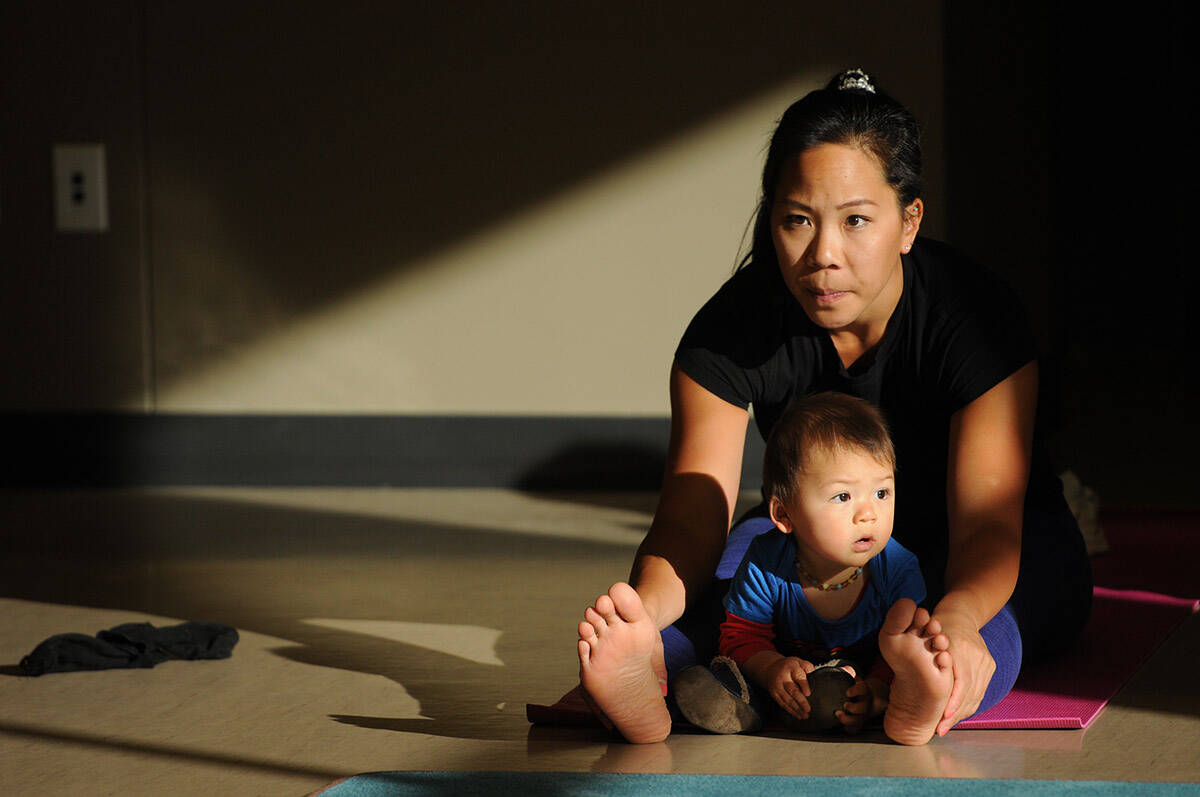 A group of moms and their babies took part in Baby Yoga at the Sardis Library on Feb. 6, 2019. Tuesday, June 21, 2022 is International Yoga Day. (Jenna Hauck/ The Progress)
