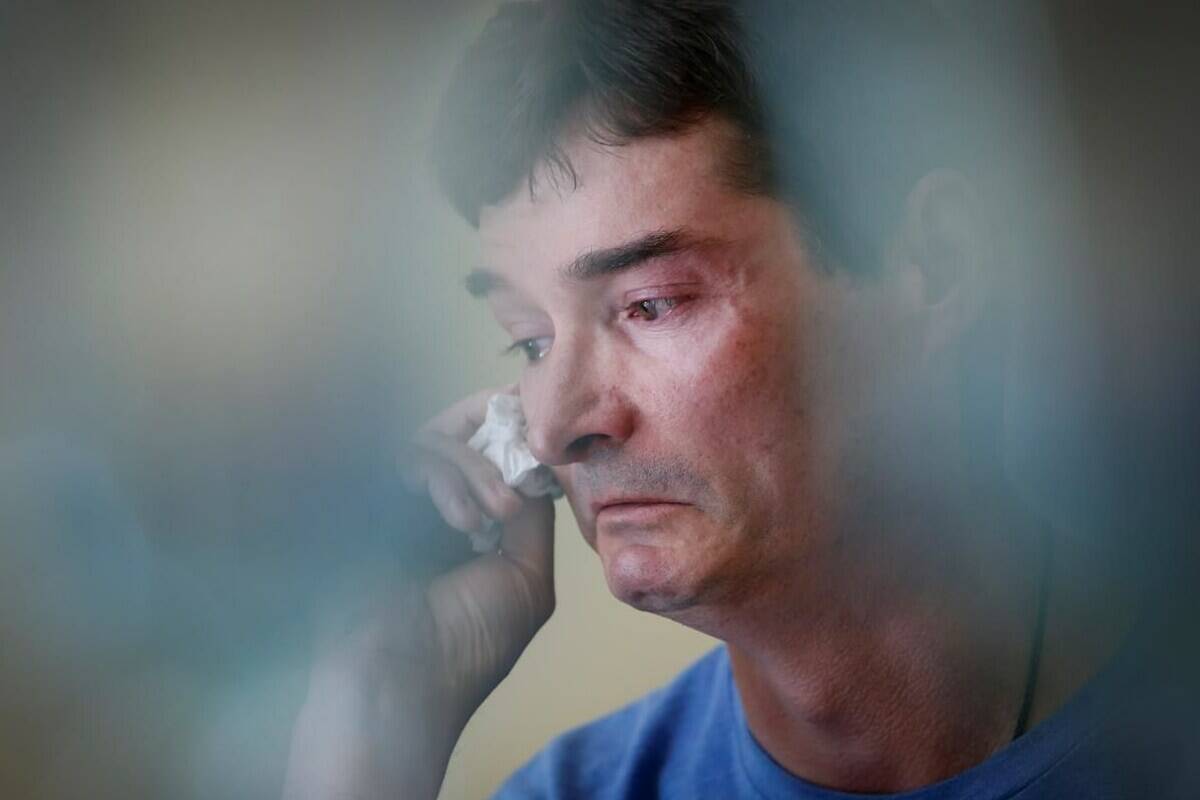 Derek Lints wipes away tears as he speaks about his son Daniel, 17, at his home in Pilot Mound, Man., on Wednesday, June 15, 2022. Daniel Lints was sexually exploited online in February and committed suicide as a result. THE CANADIAN PRESS/John Woods