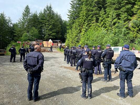Police officers forming outside the protest camp on the forestry road. (RCMP handout)