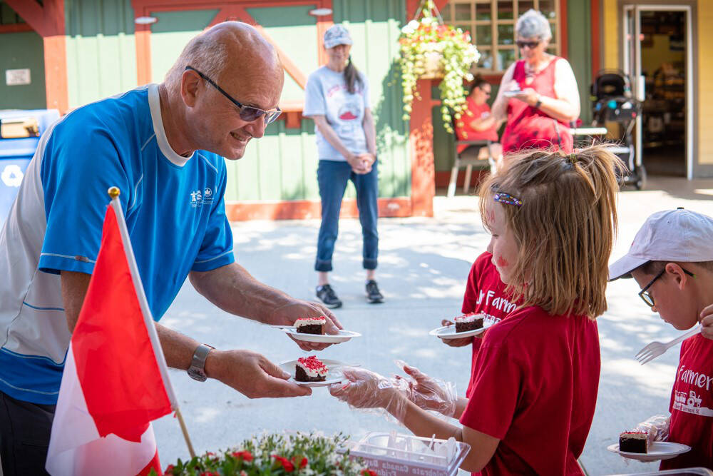 Kids were eager to enjoy some cake at Davison Orchard during Canada Day celebrations Friday, July 1. (Contributed)