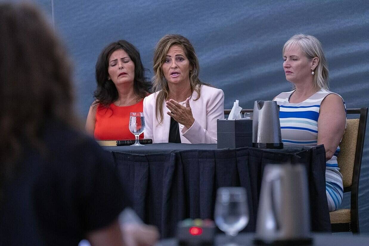 Lisa Banfield, the common-law wife of Gabriel Wortman, is flanked by her sisters Janice Banfield (left), and Maureen Banfield (right) as she testifies at the Mass Casualty Commission inquiry into the mass murders in rural Nova Scotia on April 18/19, 2020, in Halifax on Friday, July 15, 2022. Wortman, dressed as an RCMP officer and driving a replica police cruiser, murdered 22 people. THE CANADIAN PRESS/Andrew Vaughan