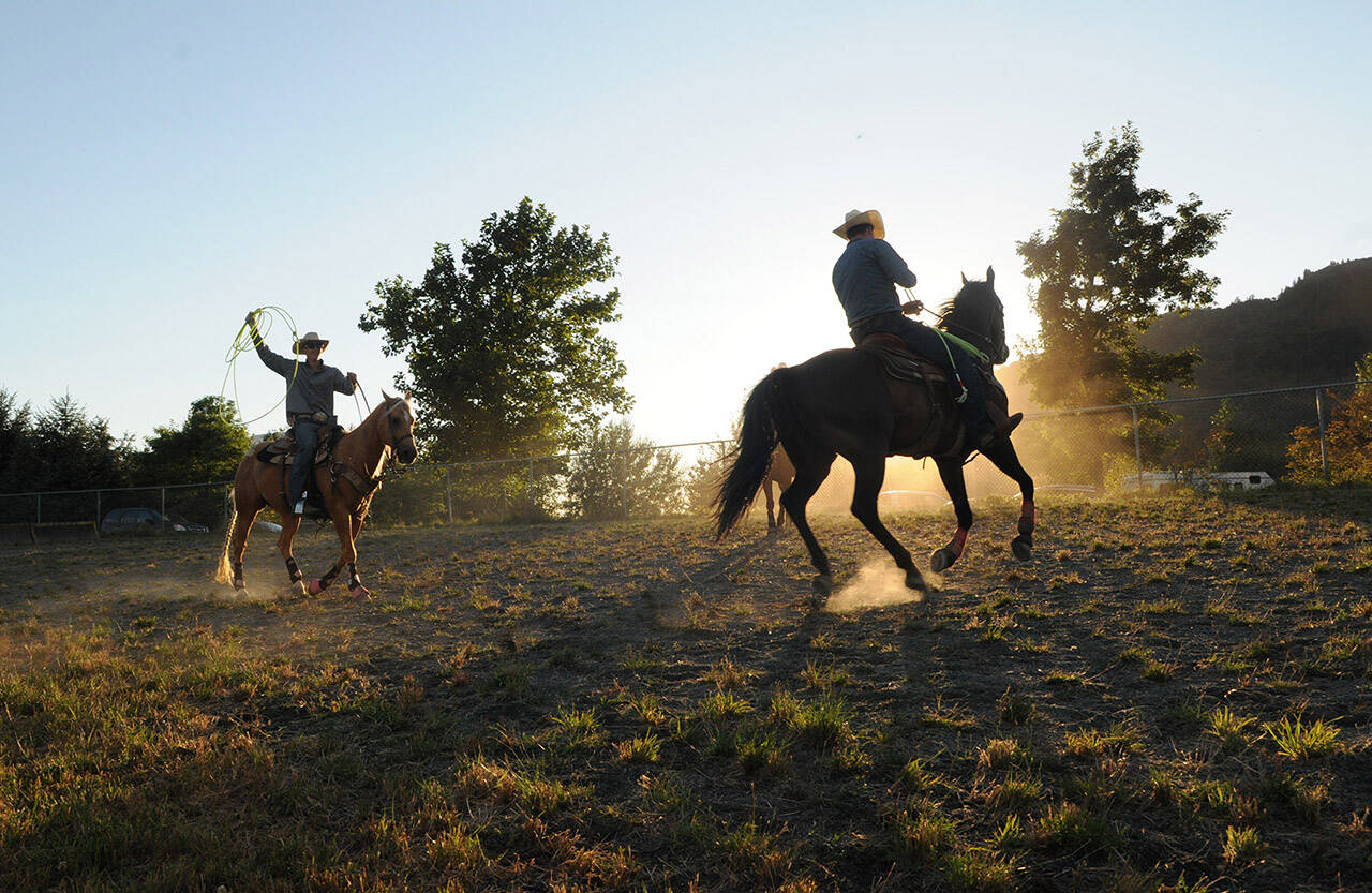 Cowboys prepare for the rodeo during the Chilliwack Fair on Aug. 5, 2016. Saturday, July 23, 2022 is Day Of The Cowboy. (Jenna Hauck/ Chilliwack Progress file)