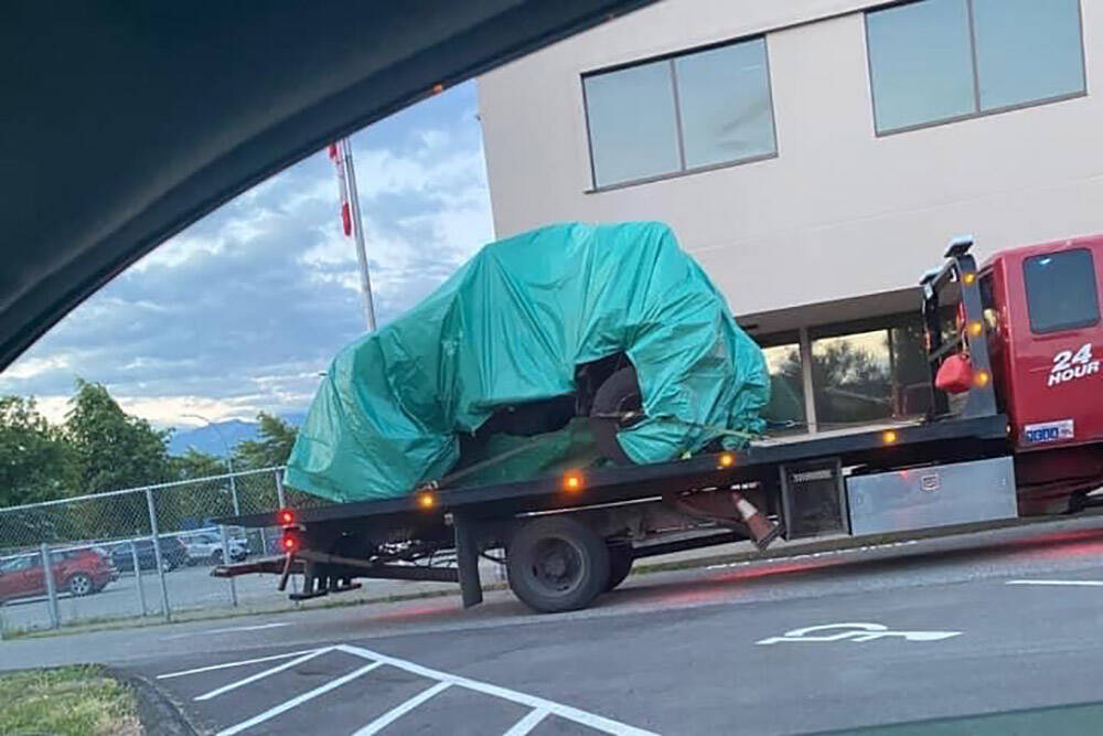 A photo of the tarp-covered vehicle. (Facebook)