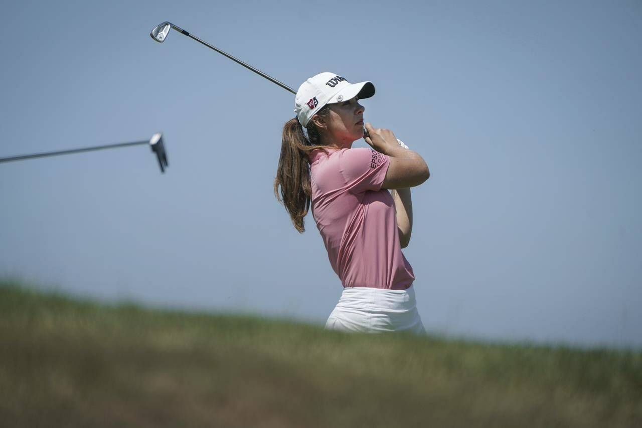 Sophia Schubert, of the United States, follows her ball after playing on the 5th hole during the last round of the Evian Championship women’s golf tournament in Evian, eastern France, Sunday, July 24, 2022. (AP Photo/Laurent Cipriani)