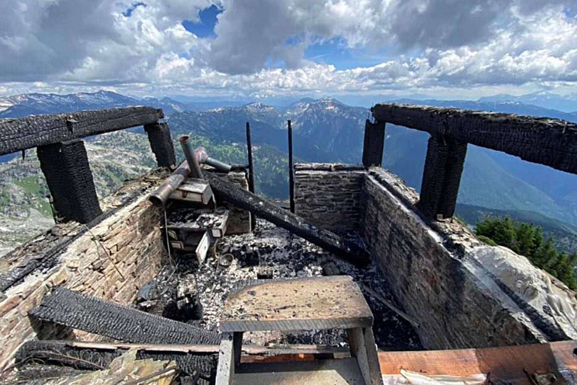 Hiker Jason Reedyk found the rehabilitated historic Eagle Pass Lookout destroyed by fire, part of it still burning, on Tuesday afternoon, Aug, 2, 2022. (Jason Reedyk photo)