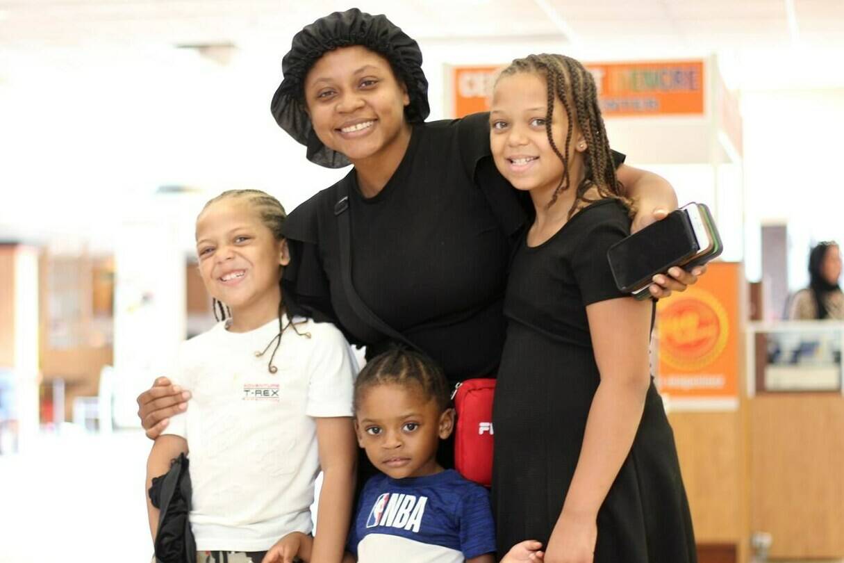 Carlyne St Jules and her children (left to right) Jonah, 7, Savior, 2, and Sophia, 10 are shown in Montreal, Saturday, July 30, 2022. Inflation may force St Jules to cut short her family vacation this year. THE CANADIAN PRESS/Christopher Reynolds