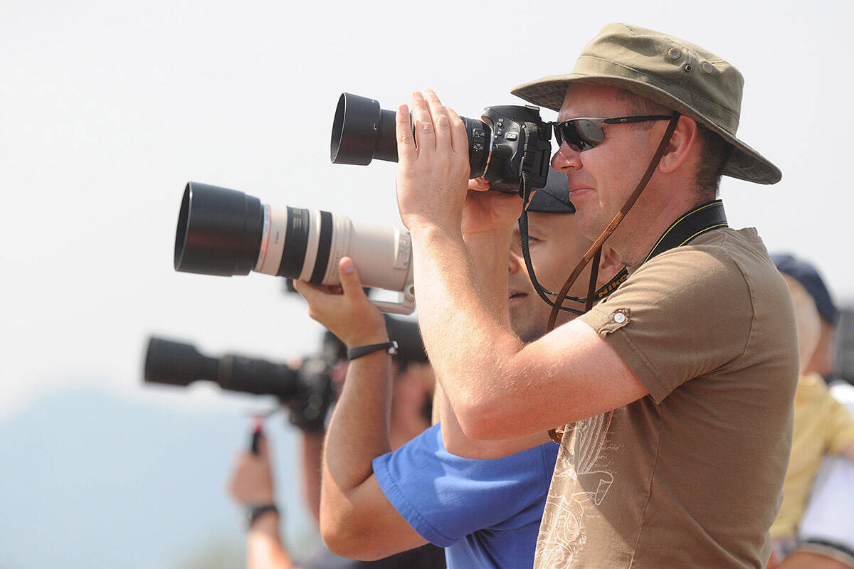 Photographers capture images at Chilliwack Flight Fest, a free air show, on Aug. 17, 2014. Friday, Aug. 19, 2022 is World Photography Day and Aviation Day. (Jenna Hauck/ Chilliwack Progress file)
