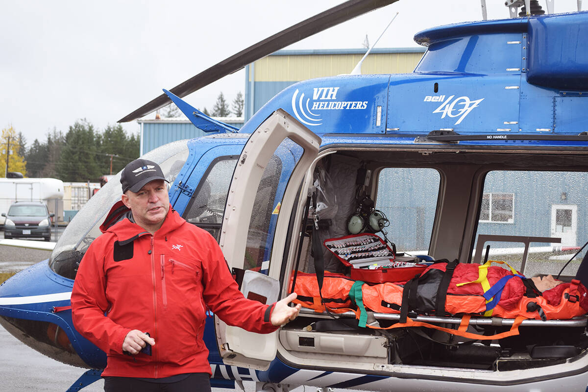 TEAAM Aeromedical President Miles Randell demonstrates how to load and unload patients from a helicopter in Campbell River on Nov. 4, 2021. Ronan O’Doherty/ Campbell River Mirror