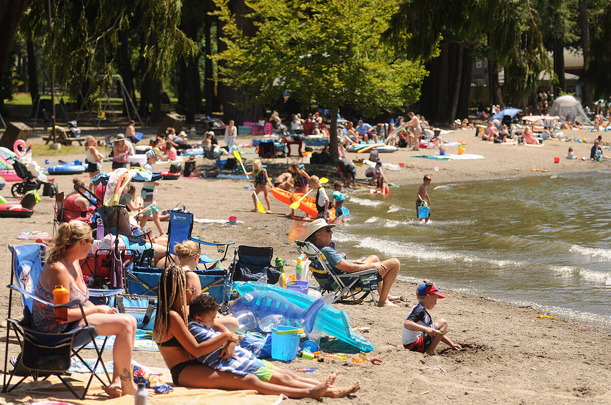 Folks take in some warm summer weather at Main Beach in Cultus Lake Park on Tuesday, July 14, 2020. Tuesday, Aug. 30, 2022 is Beach Day. (Jenna Hauck/ Chilliwack Progress file)