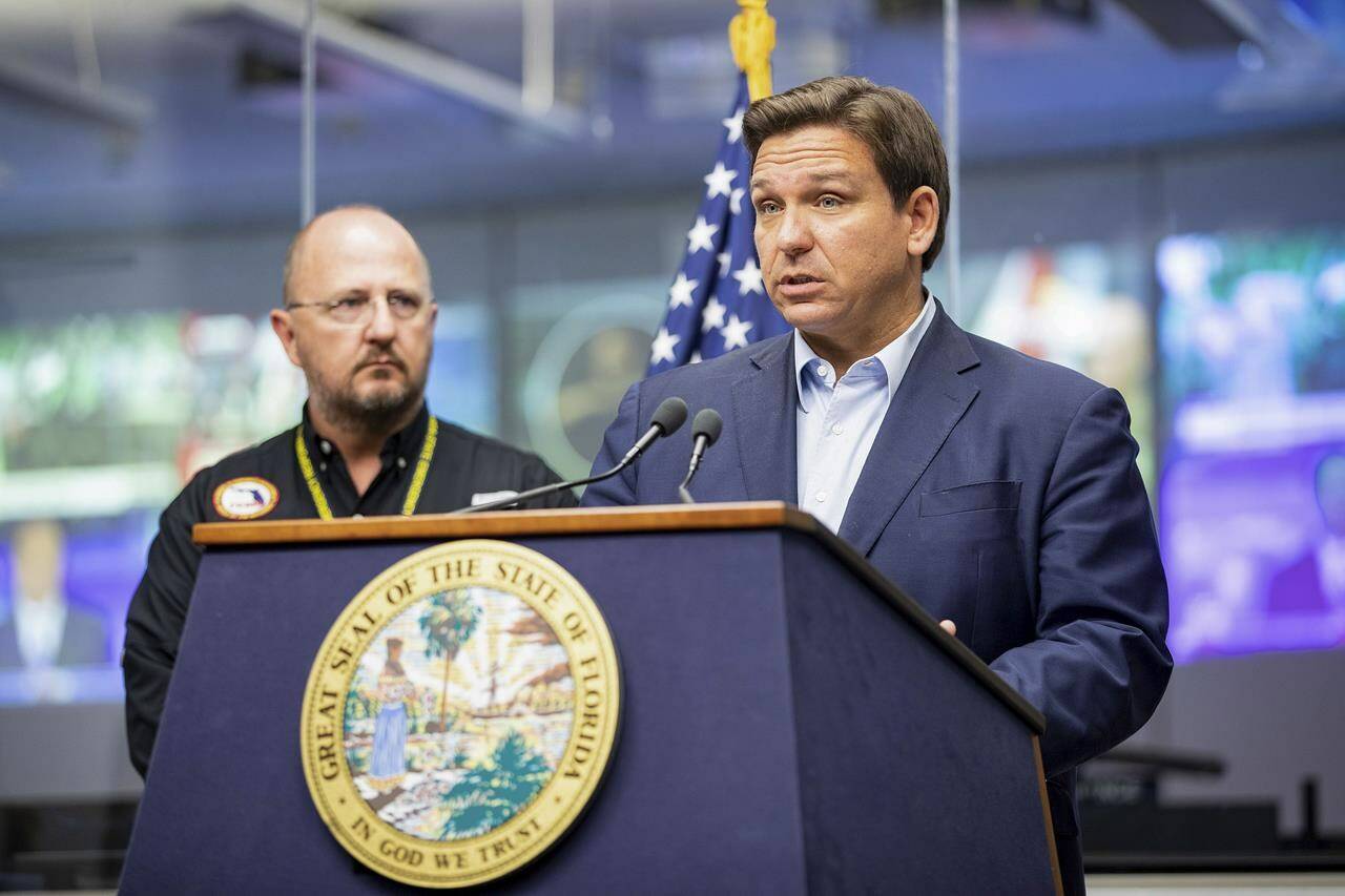 Florida Gov. Ron DeSantis speaks during a news conference at the Emergency Operations Center in Tallahassee, Fla. Sunday, Sept. 25, 2022. Authorities and residents in Florida are keeping a cautious eye on Tropical Storm Ian as it rumbles through the Caribbean. The National Hurricane Center said Sunday it expects Ian to rapidly strengthen and become a major hurricane by Monday as it passes over Cuba. Gov. DeSantis has declared a statewide emergency, expanding an order from Friday that had covered two dozen counties. (Alicia Devine/Tallahassee Democrat via AP)