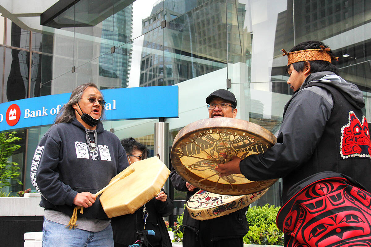 Maxwell Johnson (left) and members of the Heiltsuk Nation gathered outside the BMO on Burrard Street in Vancouver May 5 to announce a settlement has been reached after Johnson and his granddaughter were handcuffed outside the branch two years ago. (Jane Skrypnek/Black Press Media)