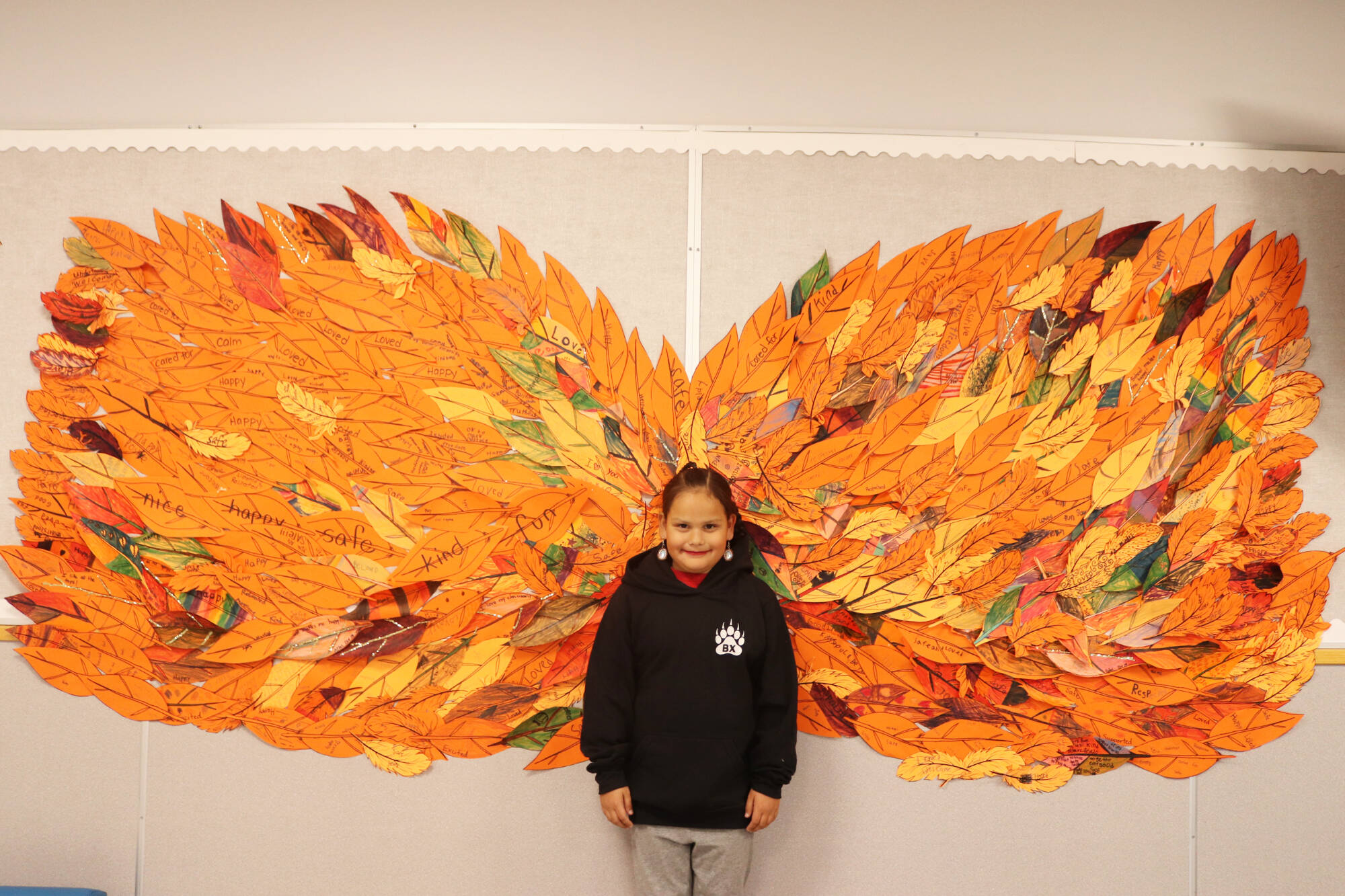 Students at BX Elementary School turned individual feathers denoting what school means to them into a collage of wings. (Brendan Shykora - Morning Star)