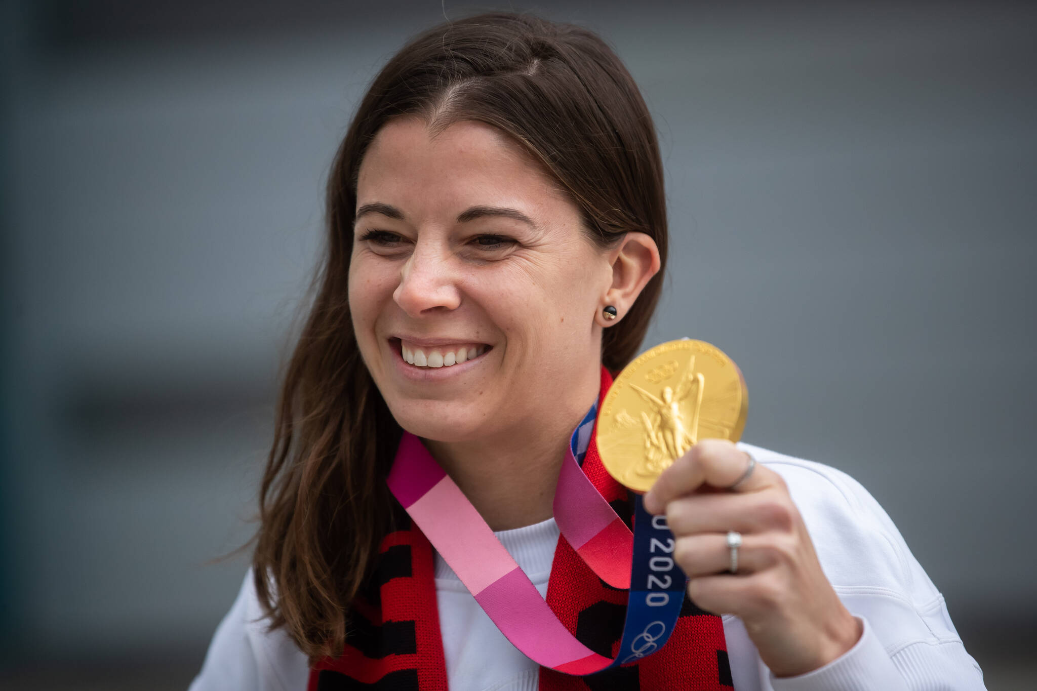 Canada women's national soccer team goalkeeper Stephanie Labbe poses for photographs with her gold medal from the Tokyo Olympics after an announcement in Vancouver, on Wednesday, March 16, 2022. Soccer Canada announced that the women's team will play Nigeria on April 8 in Vancouver and on April 11 in Langford, B.C. THE CANADIAN PRESS/Darryl Dyck