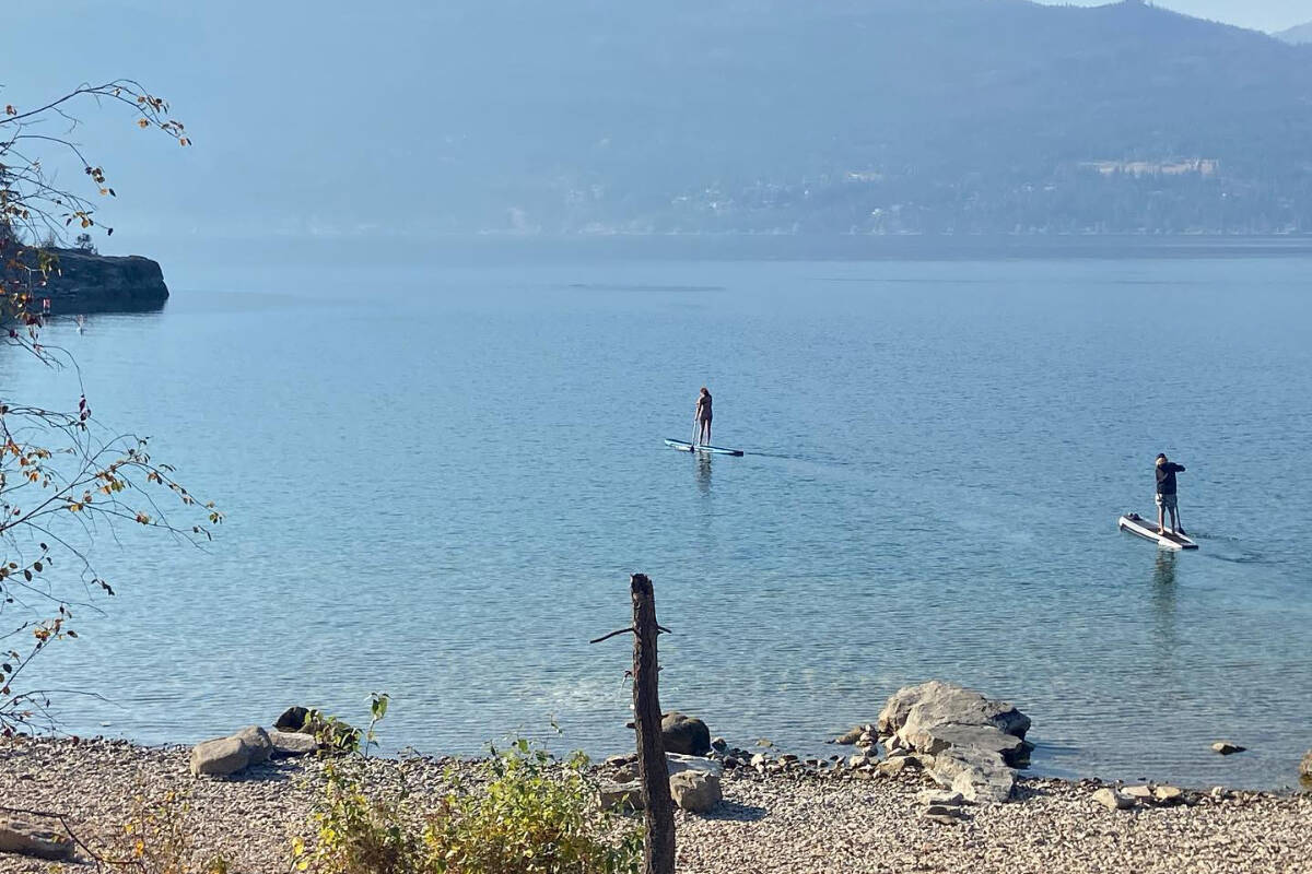 People take advantage of another record-breaking temperature day in Vernon Sunday, Oct. 9, to do some paddleboarding at Ellison Provincial Park. (Jennifer Smith - Morning Star)