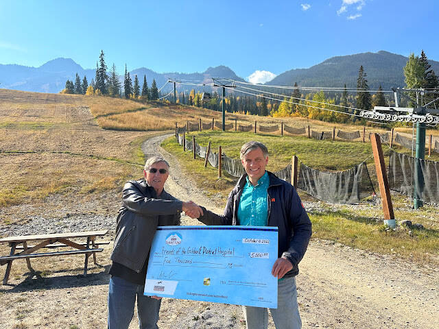 Keith Hern and Toby Barrett at Kicking Horse Mountain Resort, with the presentation of a donation to the fundraiser. (Photo submitted)