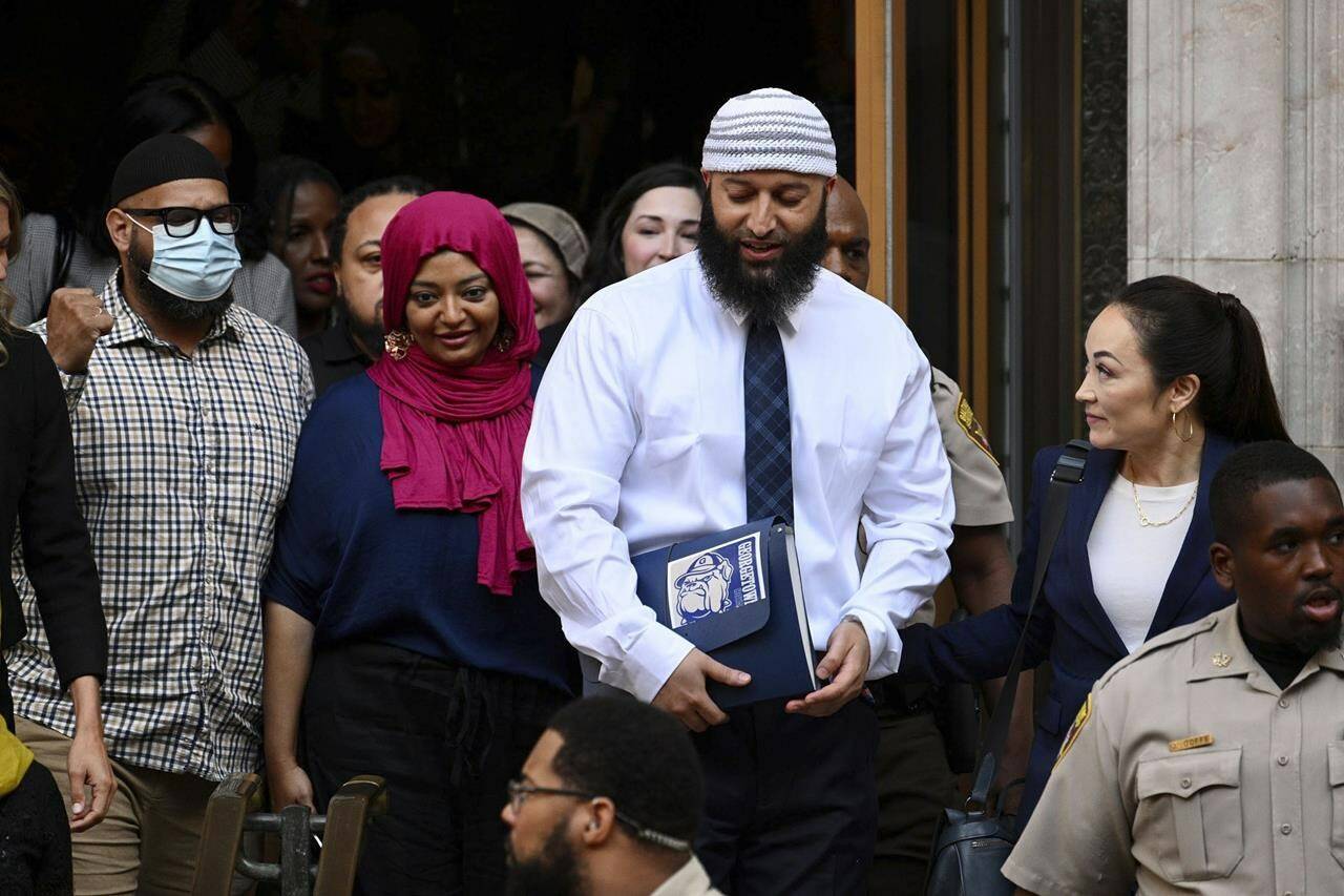 FILE - Adnan Syed, center right, leaves the courthouse after a hearing on Sept. 19, 2022, in Baltimore. Hae Min Lee’s brother, Young Lee, has asked the Maryland Court of Special Appeals to halt court proceedings for Syed, whose conviction in Lee’s 1999 killing was reversed by Baltimore Circuit Judge Melissa Phinn in September 2022. Now, the office of Maryland’s attorney general is supporting the brother’s appeal. (Jerry Jackson/The Baltimore Sun via AP, File)