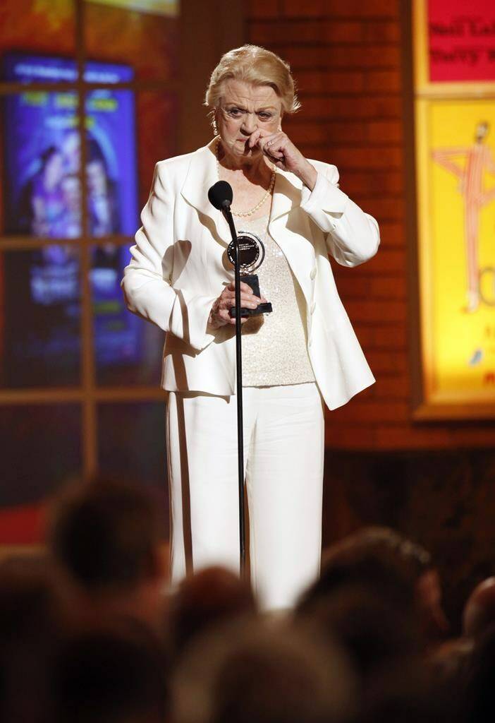 FILE - Angela Lansbury accepts her Tony Award for Best Performance by a Featured Actress in a Play for her role in “Blithe Spirit” at the 63rd Annual Tony Awards in New York on June 7, 2009. Lansbury, the big-eyed, scene-stealing British actress who kicked up her heels in the Broadway musicals “Mame” and “Gypsy” and solved endless murders as crime novelist Jessica Fletcher in the long-running TV series “Murder, She Wrote,” died peacefully at her home in Los Angeles on Tuesday. She was 96. (AP Photo/Seth Wenig, File)