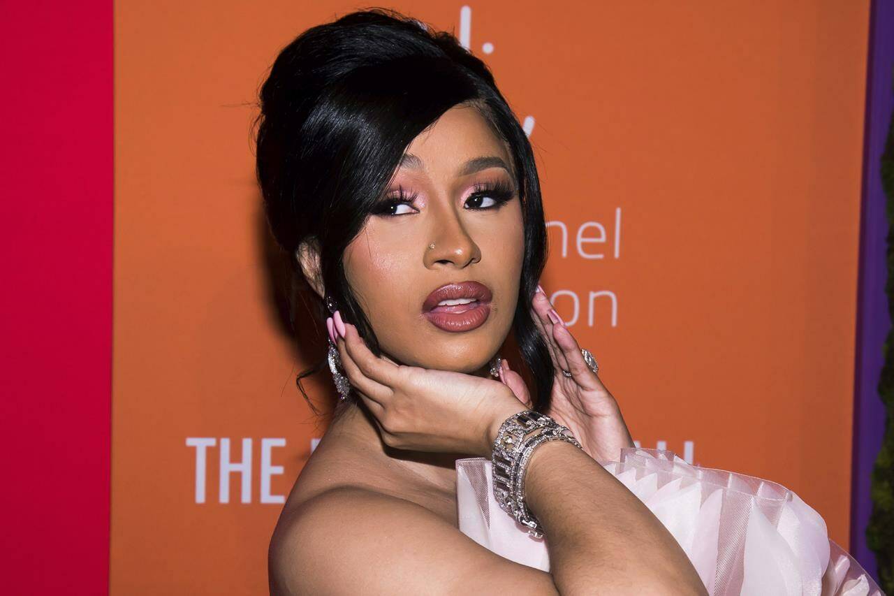FILE - Cardi B appears at the 5th annual Diamond Ball benefit gala in New York on Sept. 12, 2019. Cardi B humiliated and disrupted the life of a man whose back tattoos were illegally misappropriated for the cover of her 2016 mixtape “Gangsta Bitch Music Vol. 1,” the plaintiff’s lawyer said Tuesday, Oct. 18, 2022, during opening statements in a southern California federal court. (Photo by Mark Von Holden/Invision/AP, File)