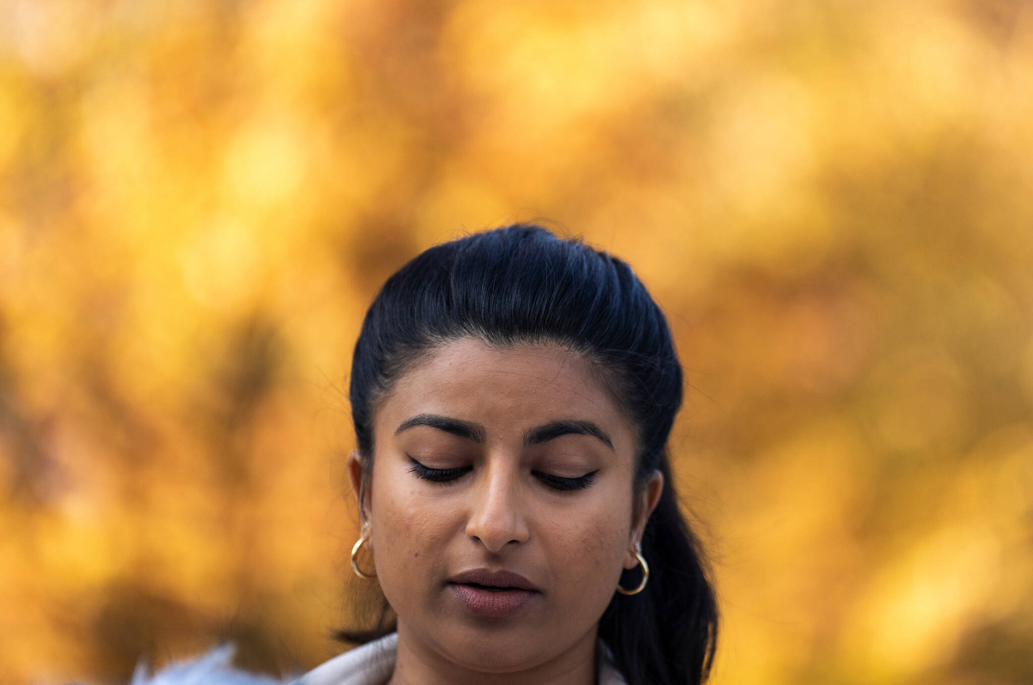 B.C. NDP leadership candidate Anjali Appadurai pauses for a moment as she addresses the media during a news conference in downtown Vancouver, Wednesday, October 19, 2022. THE CANADIAN PRESS/Jonathan Hayward