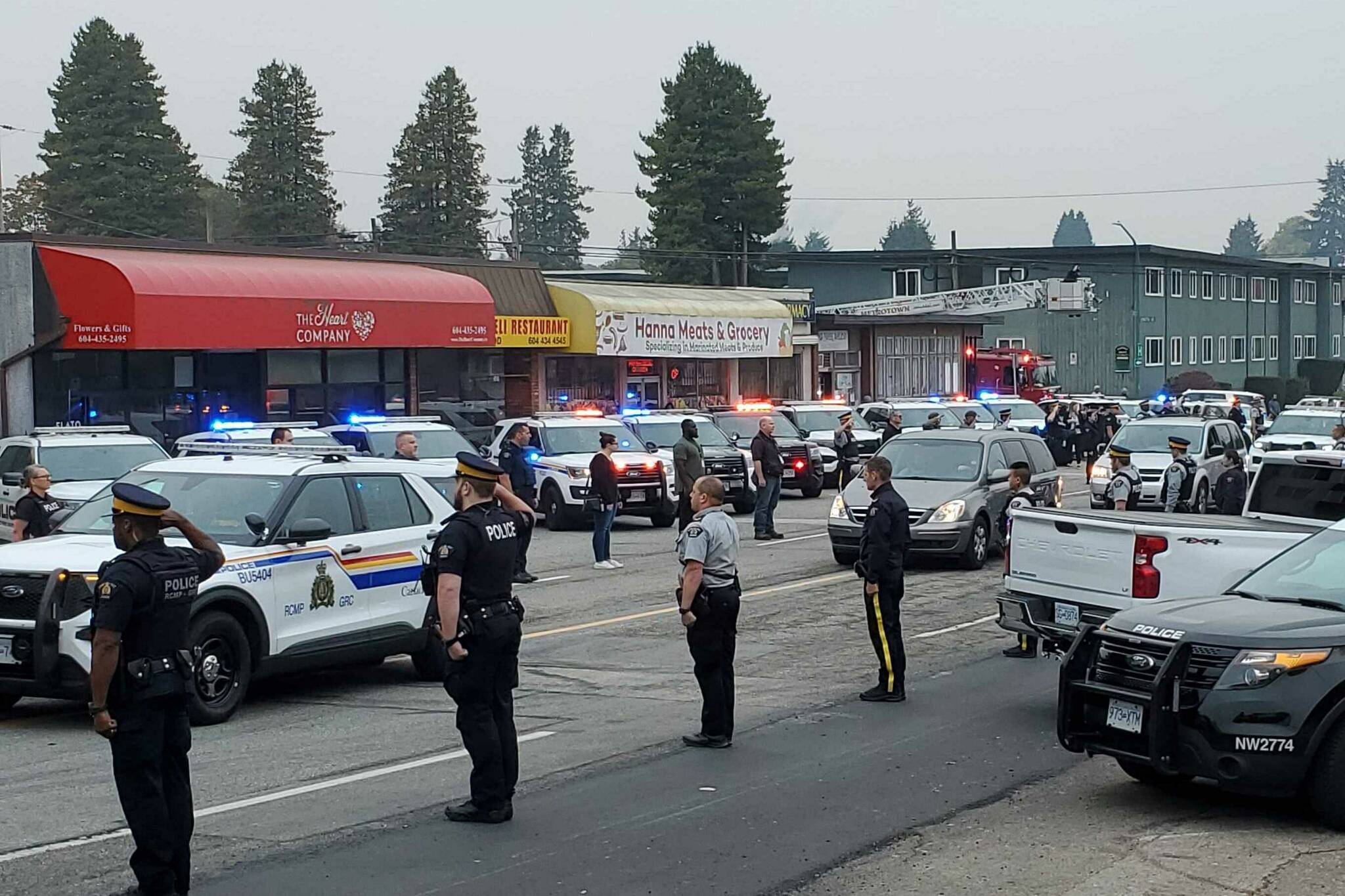 First responders line the streets in Burnaby as the body of Const. Shaelyn Yang is transported to Burnaby Hospital on Thursday, Oct. 20, 2022. (James Smith/Black Press Media)