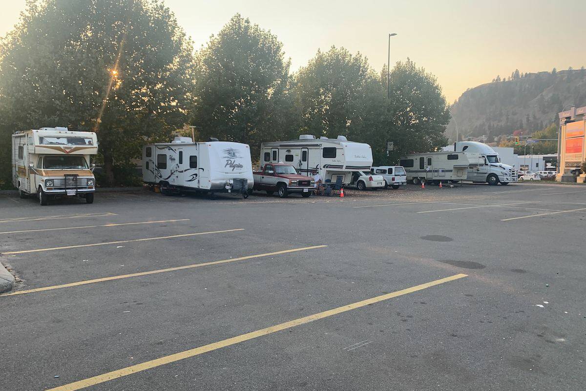 A handful of campers and RVs sit in the back corner of the Walmart Kelowna parking lot Oct. 18, 2022 (Brittany Webster - Capital News)
