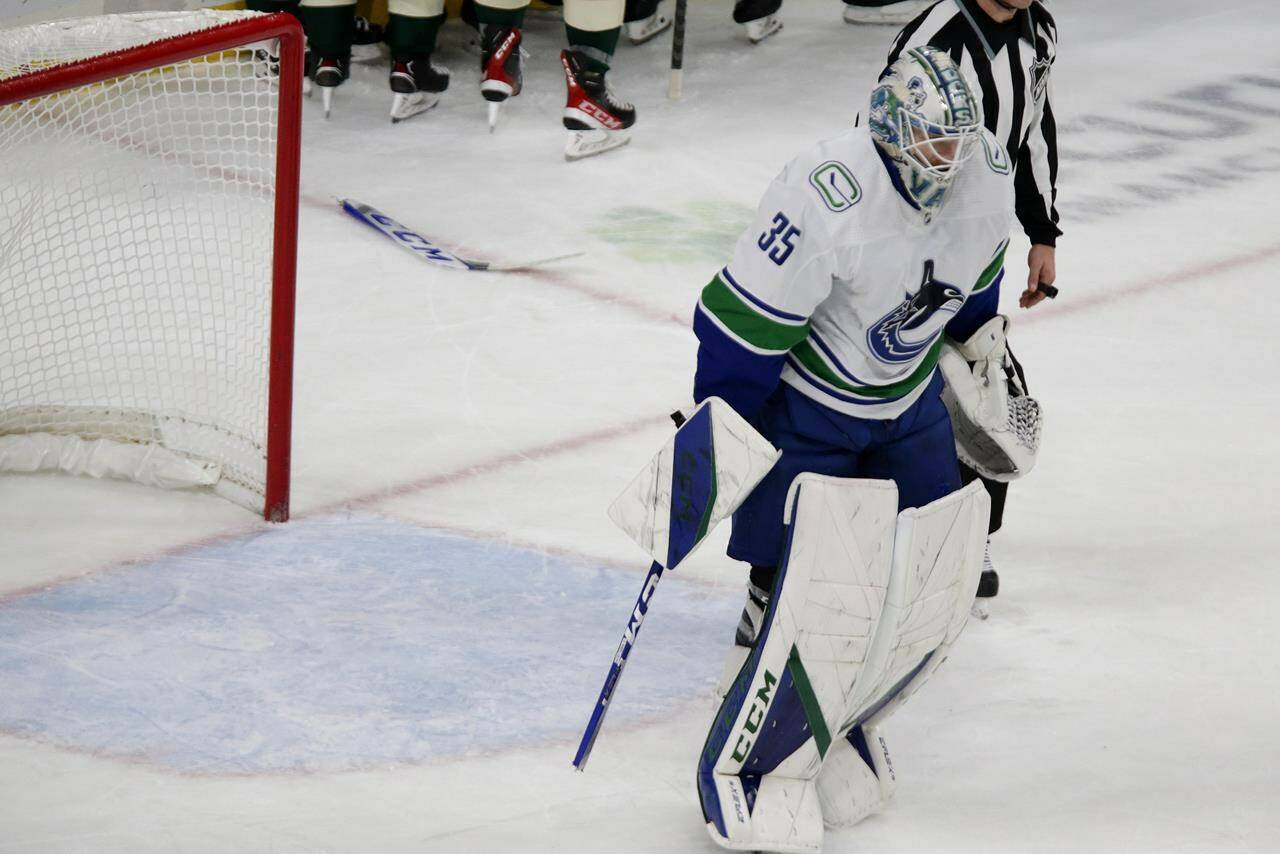 Vancouver Canucks goaltender Thatcher Demko skates off after breaking his stick following the team’s overtime loss to the Minnesota Wild in an NHL hockey game Thursday, Oct. 20, 2022, in St. Paul, Minn. On their season-opening road swing, the Canucks became the first team in NHL history to lose their first four games of the season while blowing multi-goal leads, and after five straight losses (0-3-2), Vancouver is the only team in the league that has yet to record a win. THE CANADIAN PRESS/AP-Andy Clayton-King