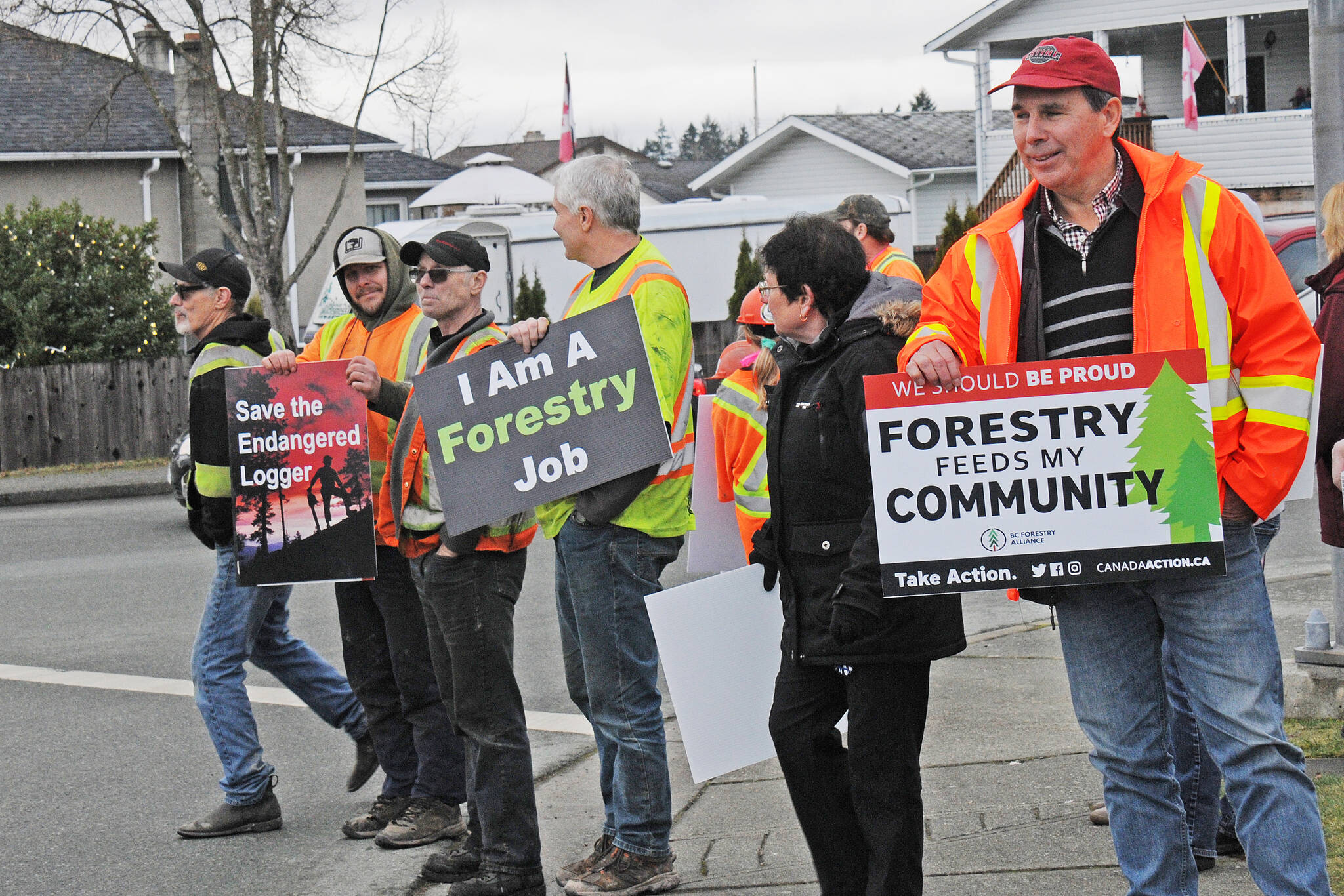 Larry Spencer, right, has been involved in the logging industry for 45 years. He attended a rally Thursday, Dec. 9, 2021 in Port Alberni backing loggers and their stance against the B.C. government’s recent two-year deferral of old-growth logging. (SUSAN QUINN/ Alberni Valley News)