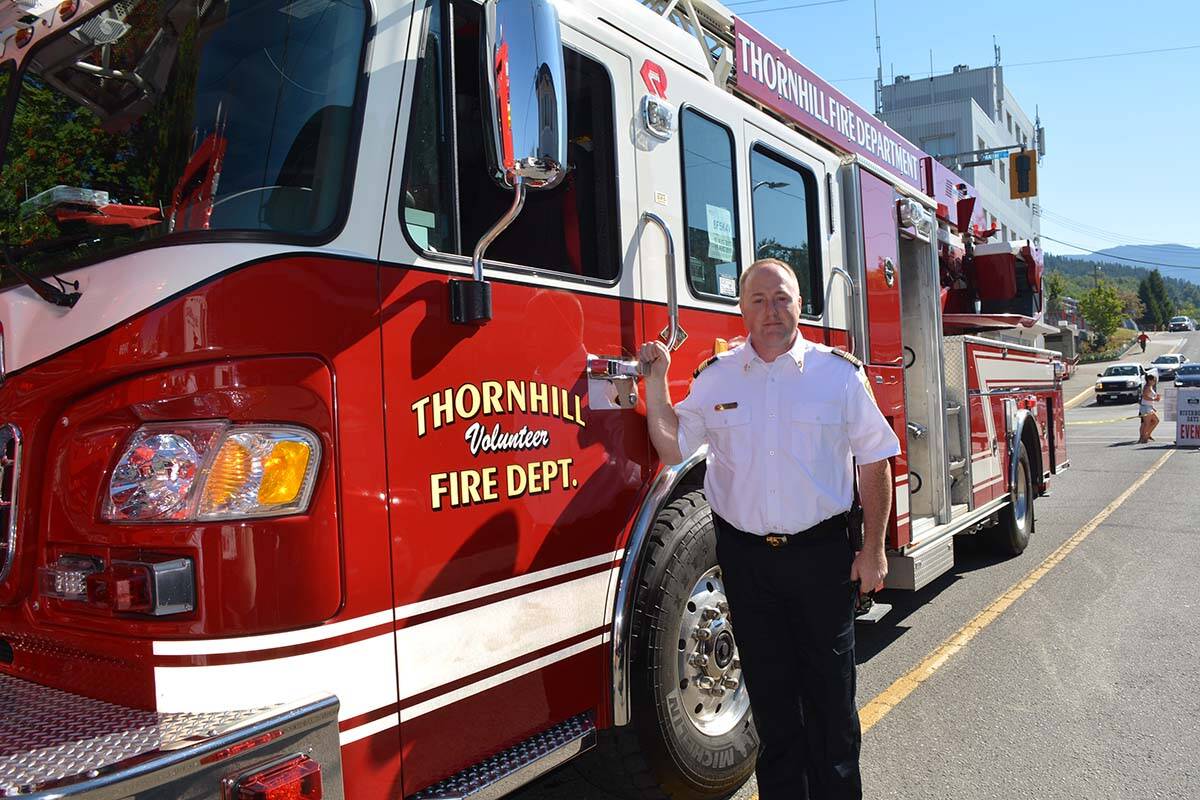 Rick Boehm, Thornhill and regional district fire chief, with the department’s new ladder truck. (File photo)