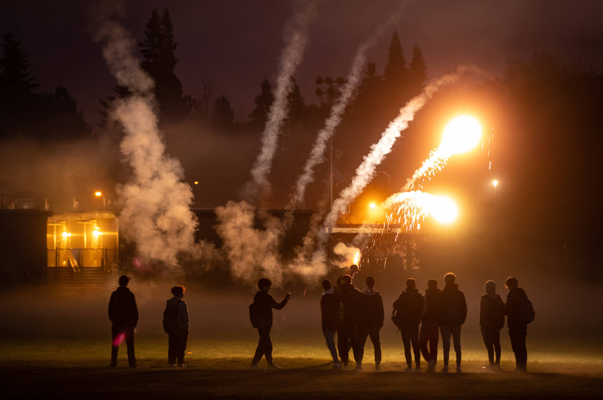 A group of young men shoot off fireworks on Halloween in Vancouver, on Saturday, October 31, 2020. THE CANADIAN PRESS/Darryl Dyck