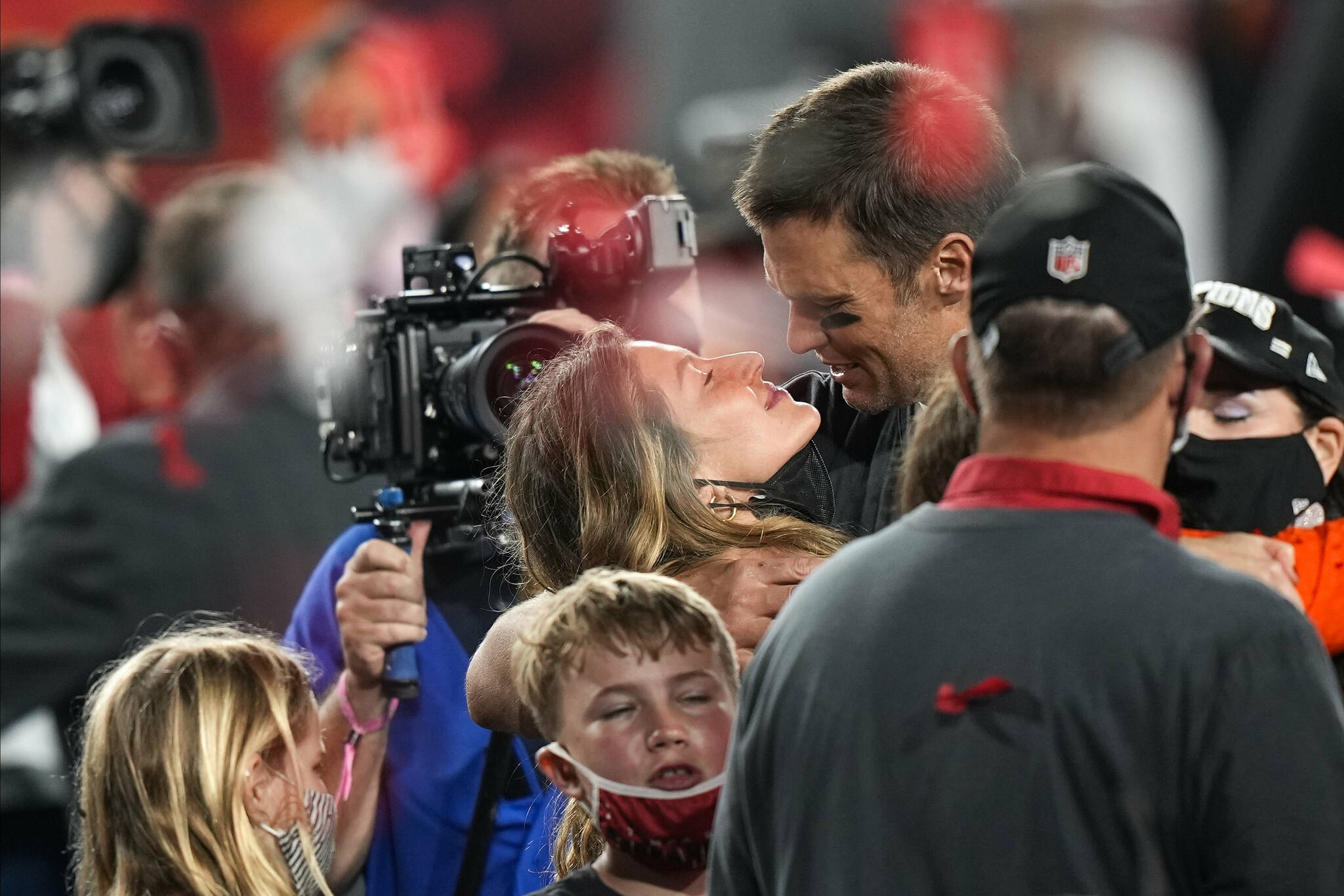 Tampa Bay Buccaneers quarterback Tom Brady celebrates with his wife Gisele Bundchen and children after the NFL Super Bowl 55 football game against the Kansas City Chiefs, Sunday, Feb. 7, 2021, in Tampa, Fla. The Buccaneers defeated the Chiefs 31-9 to win the Super Bowl. (AP Photo/David J. Phillip)