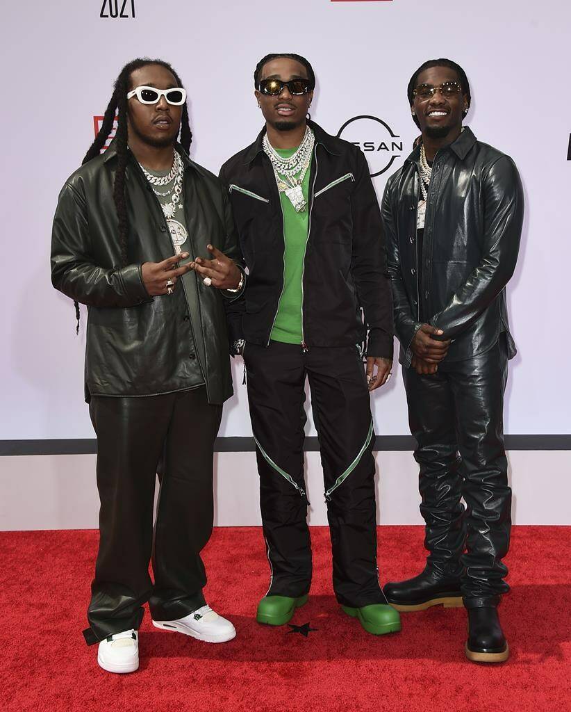 FILE - Takeoff, from left, Quavo and Offset, of Migos, arrive at the BET Awards in Los Angeles on June 27, 2021. A representative confirms that rapper Takeoff is dead after a shooting outside of a Houston bowling alley early Tuesday, Nov. 1, 2022. Takeoff , whose real name was Kirsnick Khari Ball, was 28. (Photo by Jordan Strauss/Invision/AP File)