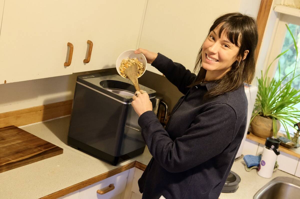 The City of Nelson’s organic waste co-ordinator Emily Mask at home with her FoodCycler. Compostable waste generally makes up 40 per cent of total household garbage. Photo: Bill Metcalfe