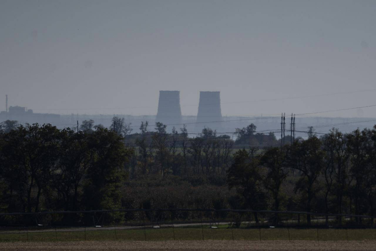 FILE - Zaporizhzhia nuclear power plant is seen from around twenty kilometers away in an area in the Dnipropetrovsk region, Ukraine, Monday, Oct. 17, 2022. (AP Photo/Leo Correa, File)