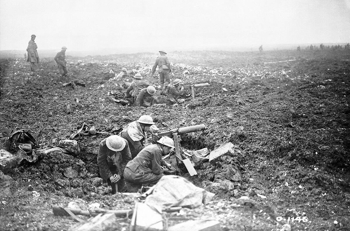 Canadian machine gunners dig themselves in shell holes on Vimy Ridge. (Canada. Dept. of National Defence / Library and Archives Canada)