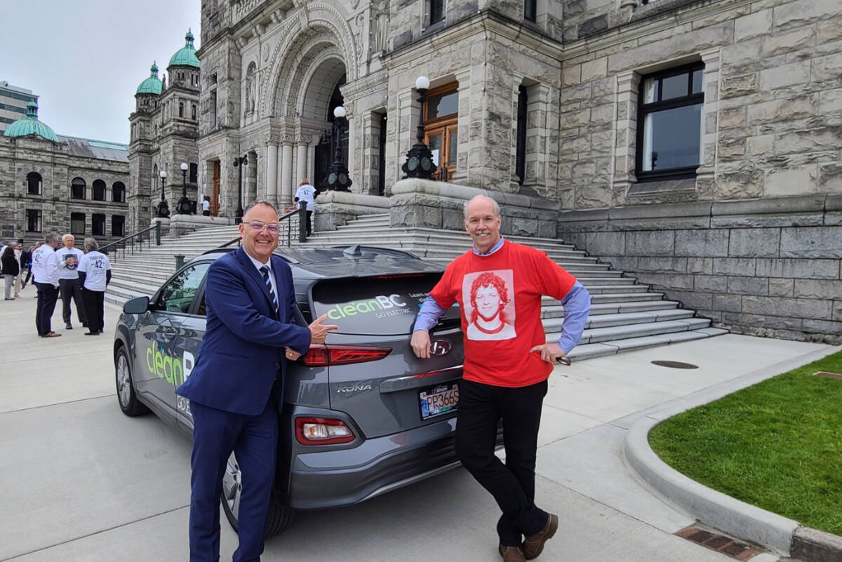 Blair Qualey, President and CEO of the New Car Dealers Association of BC, with B.C. Premier John Horgan. The NCDA is administers the electric vehicle rebate program on behalf of the provincial government. Photo courtesy NCDA