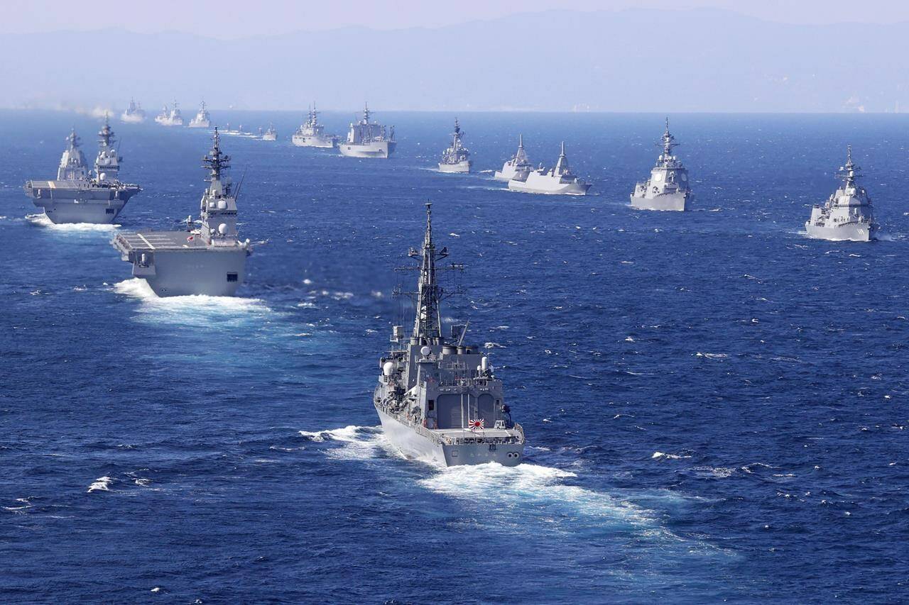 Warships from 12 countries take part in an international fleet review in Sagami Bay, south of Tokyo, Sunday, Nov. 6, 2022. Eighteen warships participated from the countries, including the United States, Australia, Canada, India, New Zealand, Singapore and South Korea, while the United States and France also sent warplanes for the review. (Iori Sagisawa/Kyodo News via AP)