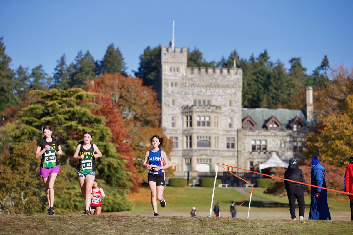 Runners in the junior girls race make their way down the Hatley Castle grounds Saturday (Nov. 5) during the B.C. High School Cross Country Championships, held at Royal Roads University. (Justin Samanski-Langille/News Staff)