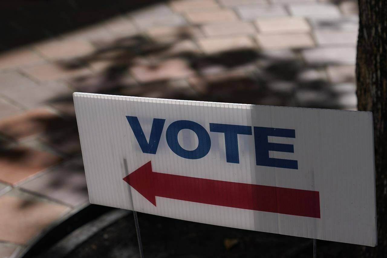 FILE - A sign that says “Vote” is placed outside of an early voting location Oct. 31, 2022, in Miami. Midterm elections are behind held on Nov. 8. (AP Photo/Lynne Sladky, File)
