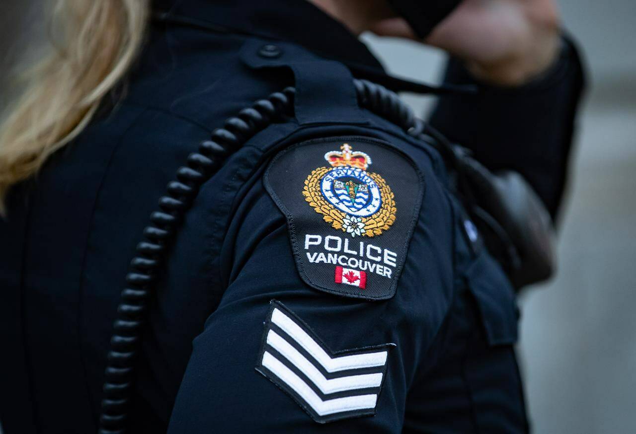 A Vancouver Police Department patch is seen on an officer’s uniform in the Downtown Eastside of Vancouver, B.C., Saturday, Jan. 9, 2021. Vancouver police have identified the suspects who threw maple syrup on an Emily Carr painting and glued themselves to the wall on Saturday at the Vancouver Art Gallery. THE CANADIAN PRESS/Darryl Dyck